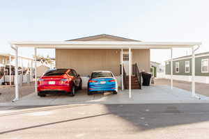 View of car parking featuring a carport
