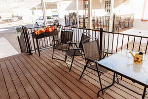 Wooden deck featuring outdoor dining space