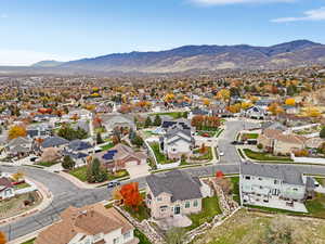 Aerial view of residential area featuring a mountainous background