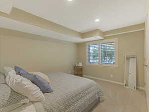 Carpeted bedroom featuring baseboards and recessed lighting