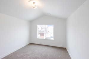 Unfurnished room with carpet flooring and baseboards