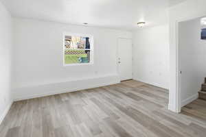 Downstairs family room with new LVP flooring and paint. Walk out door to back yard