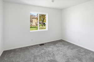 Bedroom 1 featuring brand new paint and carpet