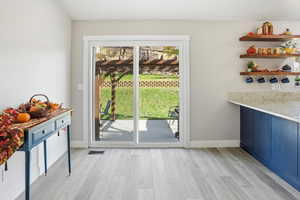 Space by kitchen, great for dining table, breakfast nook or comfy seating