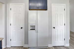Two pantry closets on either side of the fridge
