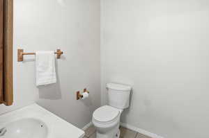 Half bath by laundry room and garage