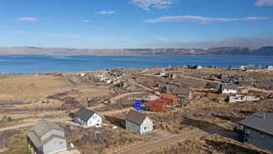 Aerial view of residential area with a water and mountain view