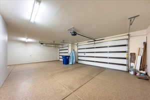 Garage featuring a garage door opener