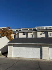 View of front of property with a shingled roof