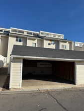 View of front facade featuring a shingled roof