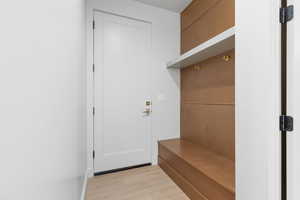Mudroom featuring light wood-style flooring