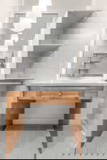 Bathroom featuring light colored carpet and vanity