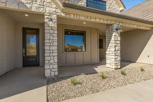 Property entrance featuring stone siding
