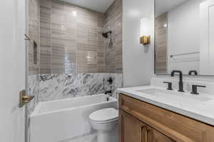 Bathroom with shower / washtub combination and vanity