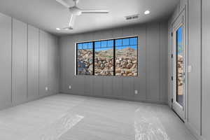 Unfurnished room featuring light carpet, a decorative wall, recessed lighting, and a ceiling fan