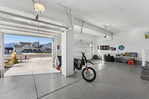 Garage featuring a mountain view and epoxy flooring
