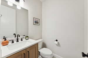 Bathroom with vanity and toilet