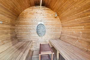Sauna with wooden ceiling and wood walls