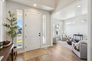 Entryway featuring wood finished floors and recessed lighting