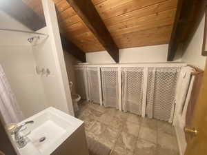Full bath featuring a shower stall, a wooden ceiling with exposed beams, and vanity
