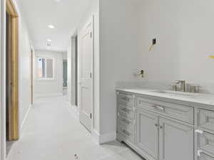Jack and Jill bathroom with 2 vanities, large shower, toilet and 2 walk-in closets