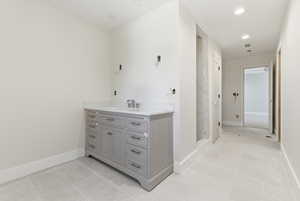 Jack and Jill bathroom with 2 vanities, large shower, toilet and 2 walk-in closets