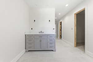 Jack and Jill bathroom with 2 vanities, large shower, toilet and 2 walk-in closets