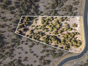 Aerial view of property and surrounding area featuring property boundaries highlighted