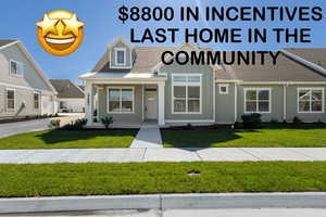 View of front of house with a front lawn, board and batten siding, and a porch