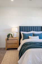 Carpeted bedroom featuring baseboards