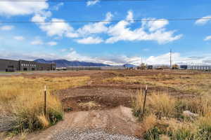 View of street featuring a mountain view and a view of rural / pastoral area
