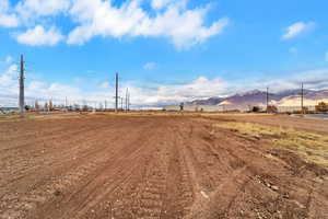 View of yard featuring a mountain view and a view of rural / pastoral area