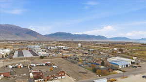 View of mountain background featuring an industrial area