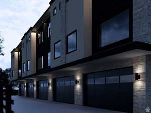 View of building exterior featuring a garage