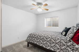 Bedroom featuring carpet floors and a ceiling fan