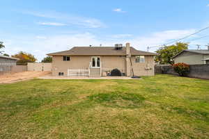 Rear view of house featuring a patio area, a fenced backyard, and stucco siding
