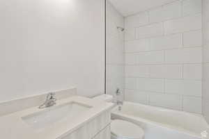 Full bathroom featuring vanity and washtub / shower combination