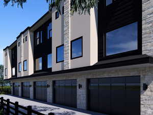 View of building exterior featuring a garage