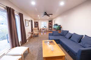 Living area featuring recessed lighting and a ceiling fan