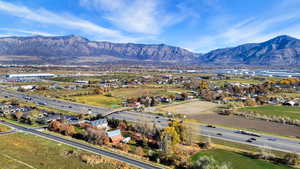 Aerial view of a major roadway and a mountain backdrop