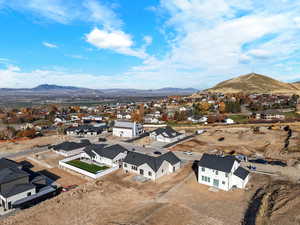 Aerial view of residential area featuring a mountain backdrop