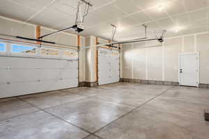 Garage featuring a garage door opener