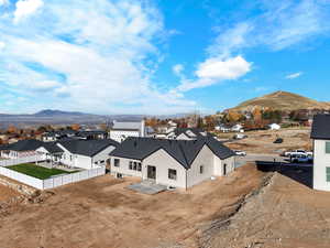 Aerial perspective of suburban area with a mountain backdrop