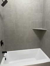 Full bathroom with shower / bathtub combination