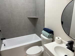 Bathroom with vanity and shower / bath combination