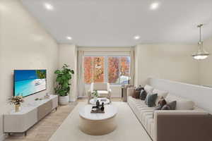 Living area featuring wood finished floors and recessed lighting