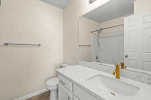 Full bath featuring vanity and  shower combination