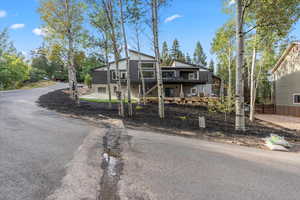 View of front facade featuring a wooden deck
