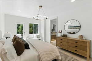 Bedroom featuring recessed lighting, light tile patterned flooring, access to outside, and connected bathroom