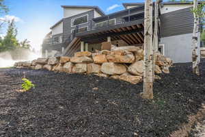 View of side of property featuring a deck